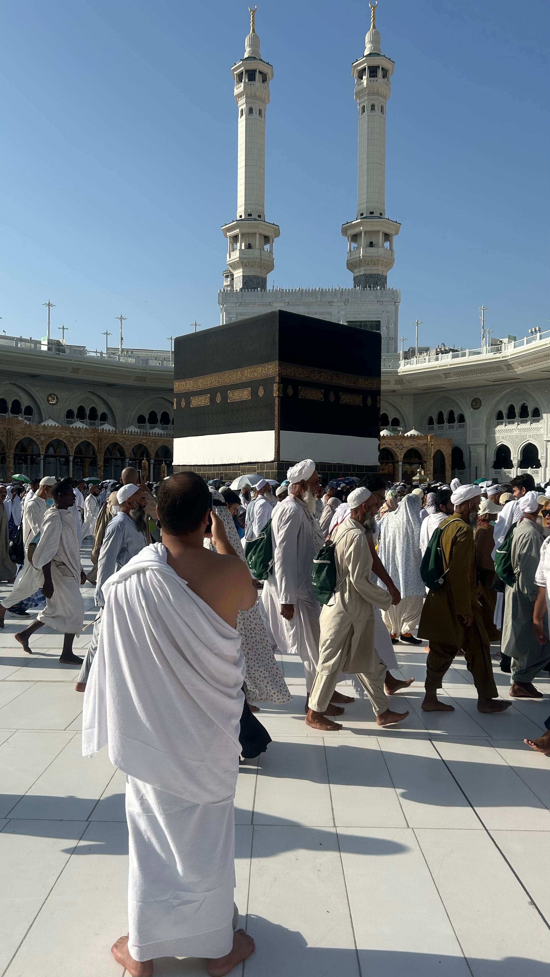 Men in Ihram near the Kaaba